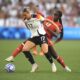 Canada midfielder Simi Owujo battles Klara Buhl of Germany.
