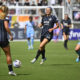 Washington Spirit and Houston Dash battle for the ball