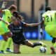Julia Grosso falls during a ground duel with the Washington Spirit on May 10, 2025.